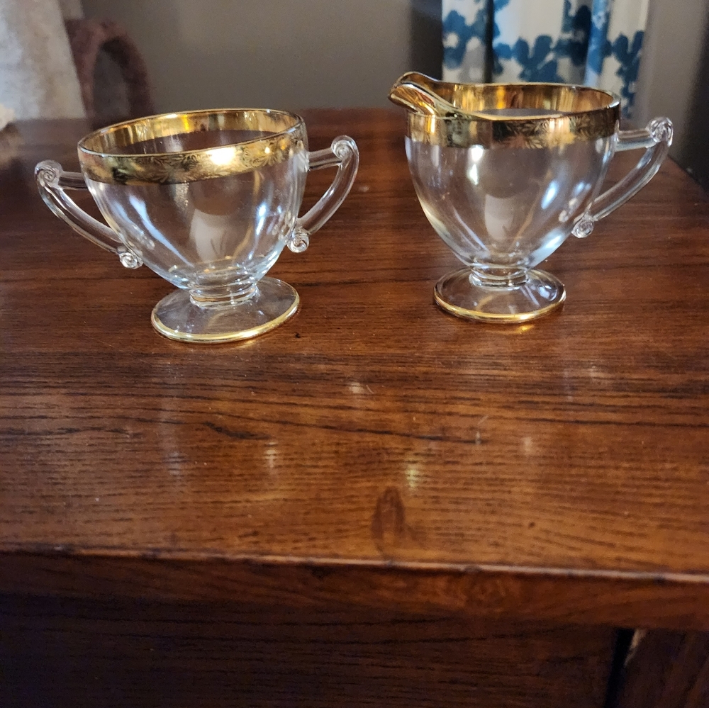 Vintage creamer and sugar. Clear with gold trim.  Depression glass